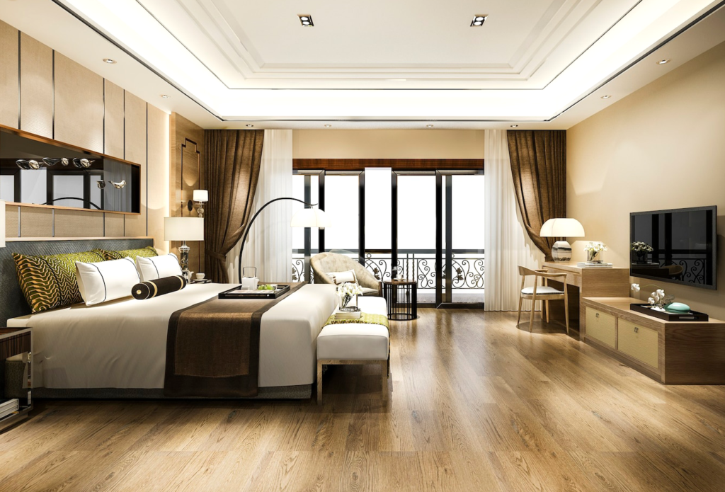 Modern luxury bedroom with elegant decor, featuring a large bed, stylish furniture, and warm lighting for a cozy ambiance.