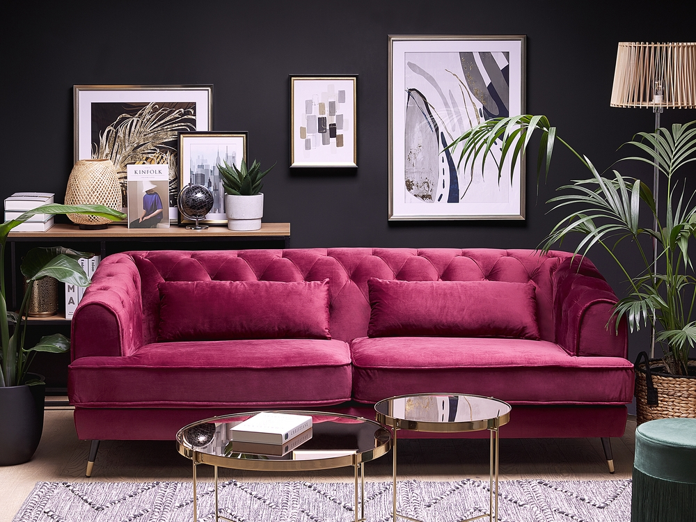 Elegant pink sofa in a stylish living room with modern art, perfect for pet-friendly spaces.