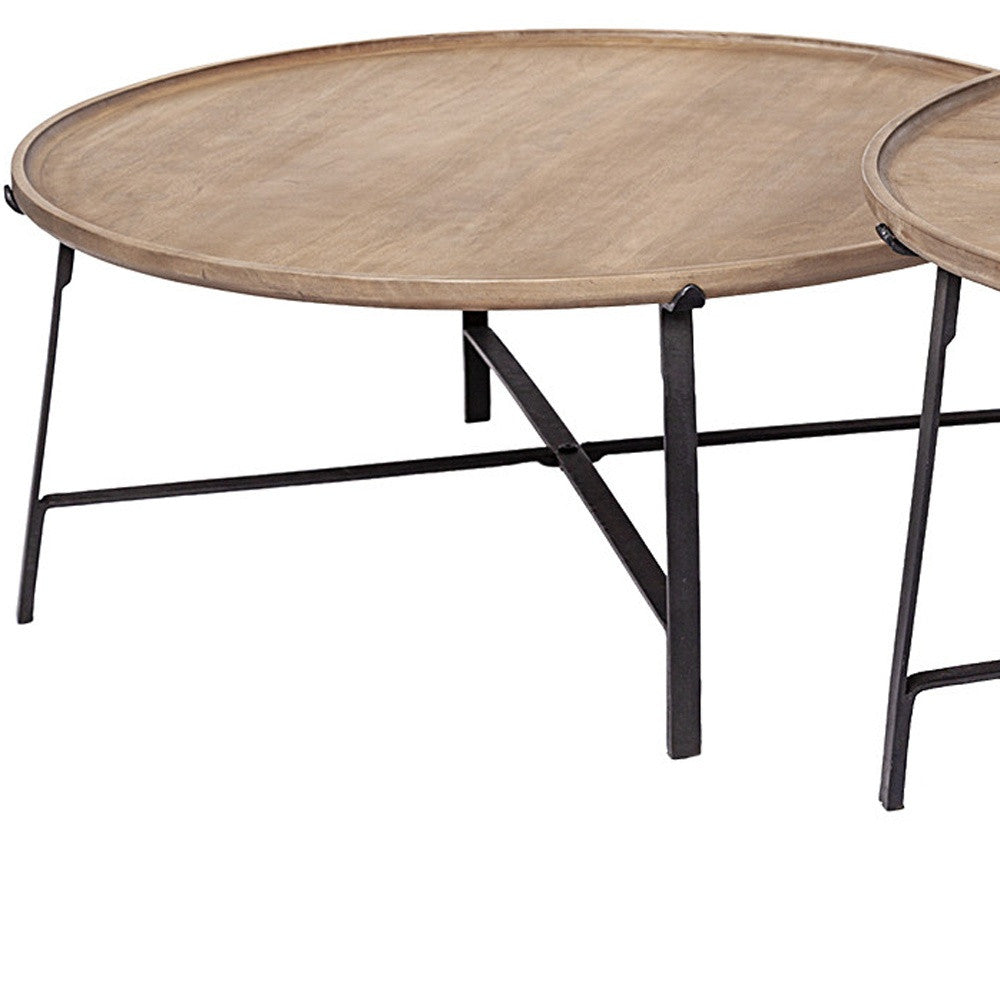 Set of Two 41" Brown And Black Solid Wood And Iron Round Nested Coffee Tables