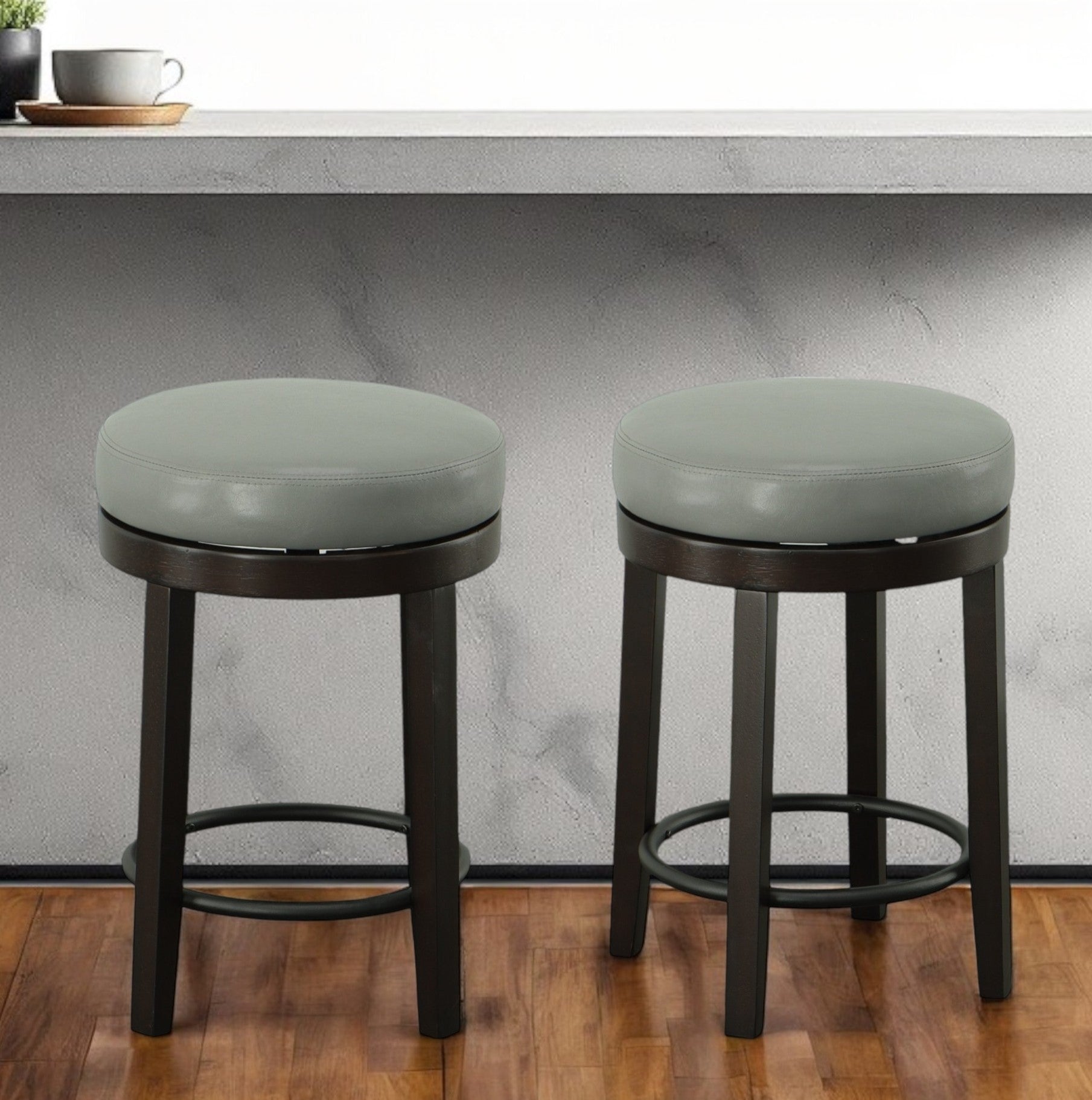 Set of Two 24" Gray And Espresso Faux Leather And Solid Wood Swivel Backless Counter Height Bar Chairs