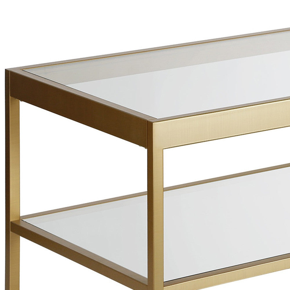 45" Clear Glass And Gold Steel Coffee Table With Shelf