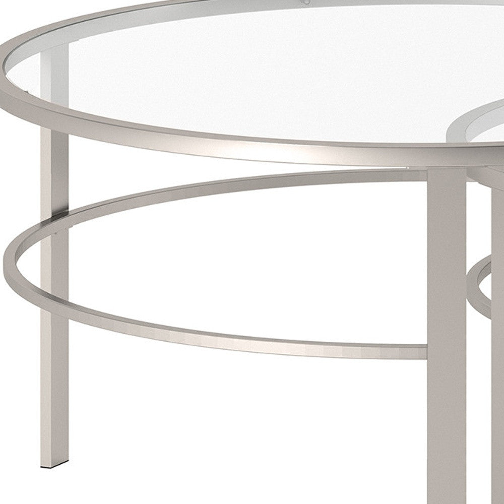 Set of Two 36" Clear and Silver Glass And Steel Round Nested Coffee Tables