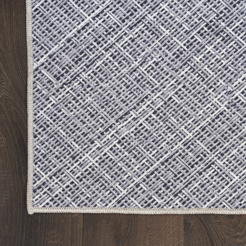 5' x 7' Gray and Ivory Abstract Power Loom Washable Non Skid Area Rug