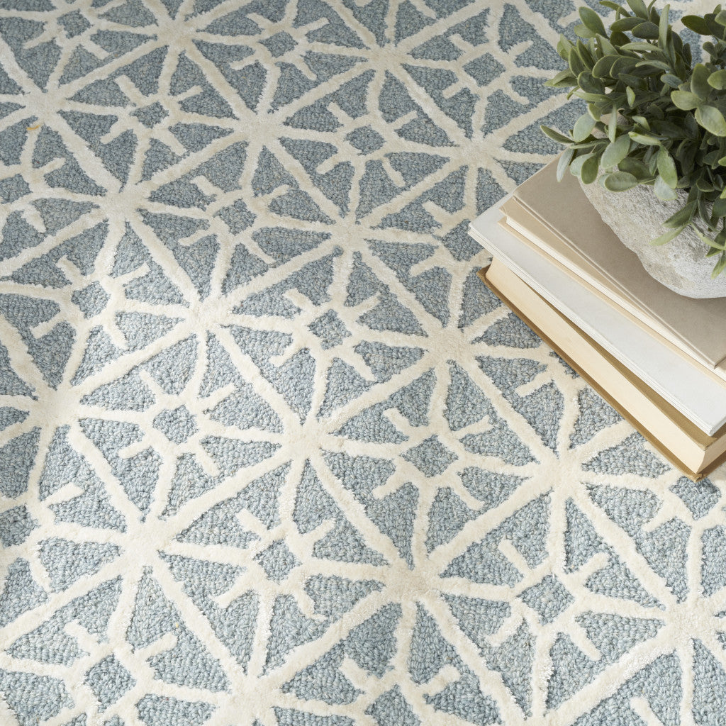 5' x 7' Light Blue and White Geometric Hand Tufted Area Rug